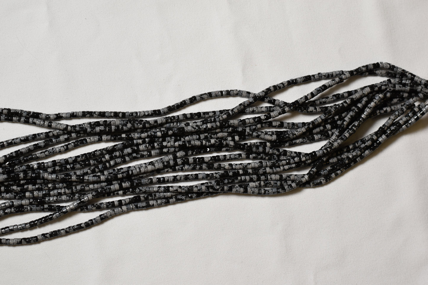 Crafting supplies such as Snowflake Obsidian Beads available at wholesale and retail prices, only at our crystal shop in San Diego!