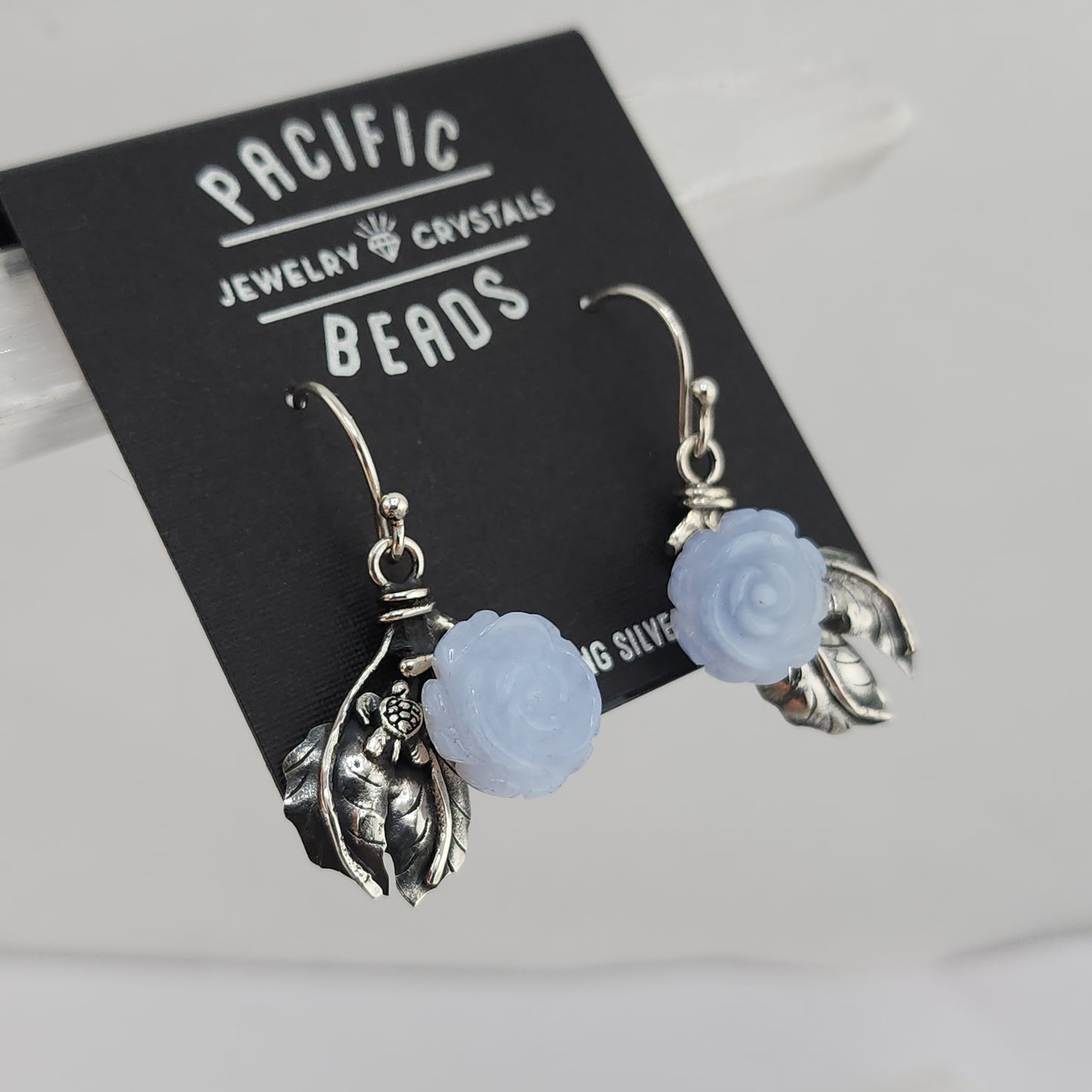 Shlomo designer sterling silver blue lace agate rose earrings available at wholesale and retail prices, only at our crystal shop in San Diego!