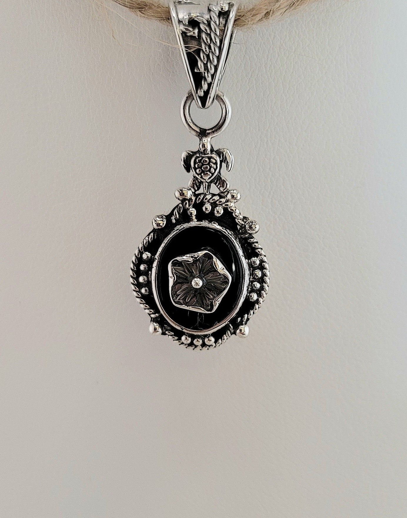 S.S. Shlomo Black Onyx and Shell Flower Pendants