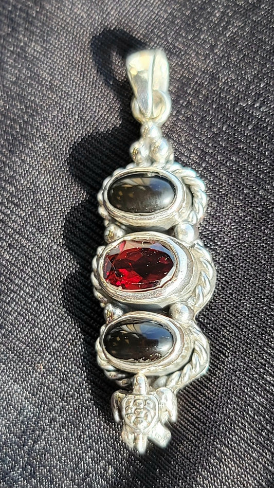 S.S. Shlomo Garnet and Black Onyx Pendants