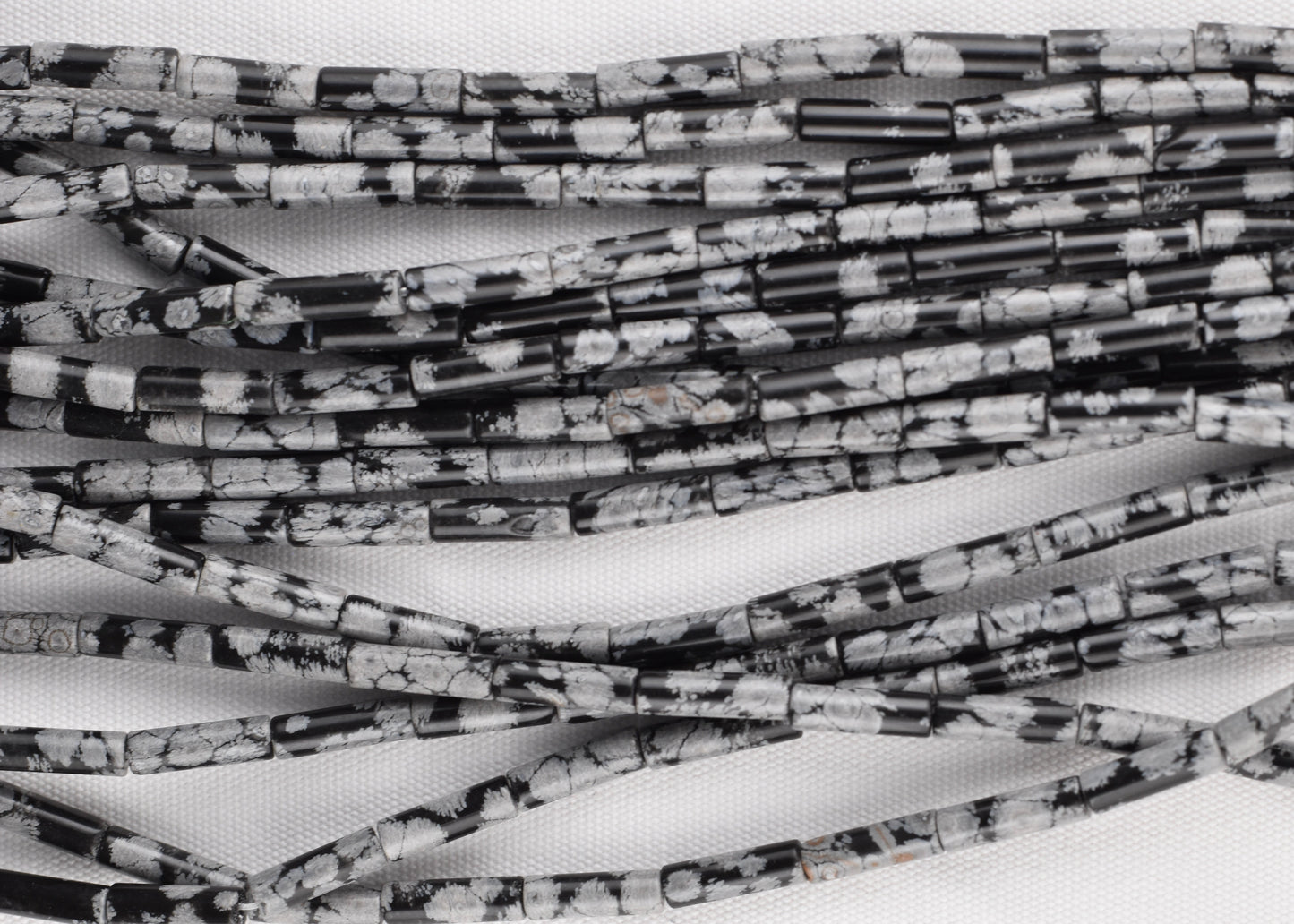 Crafting supplies such as Snowflake Obsidian Beads available at wholesale and retail prices, only at our crystal shop in San Diego!