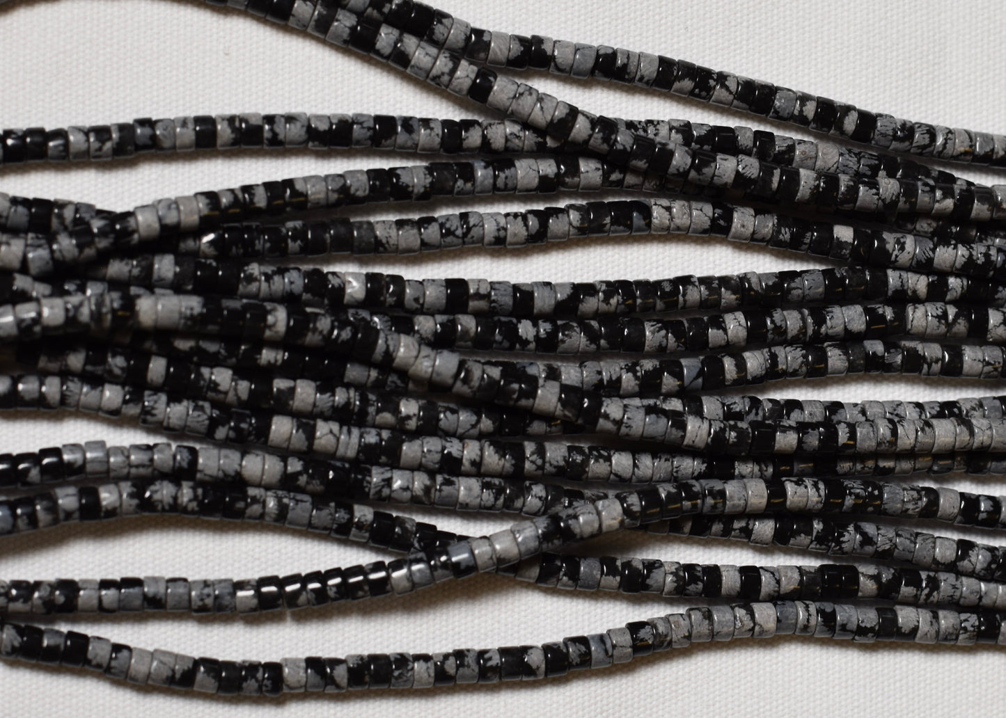Crafting supplies such as Snowflake Obsidian Beads available at wholesale and retail prices, only at our crystal shop in San Diego!