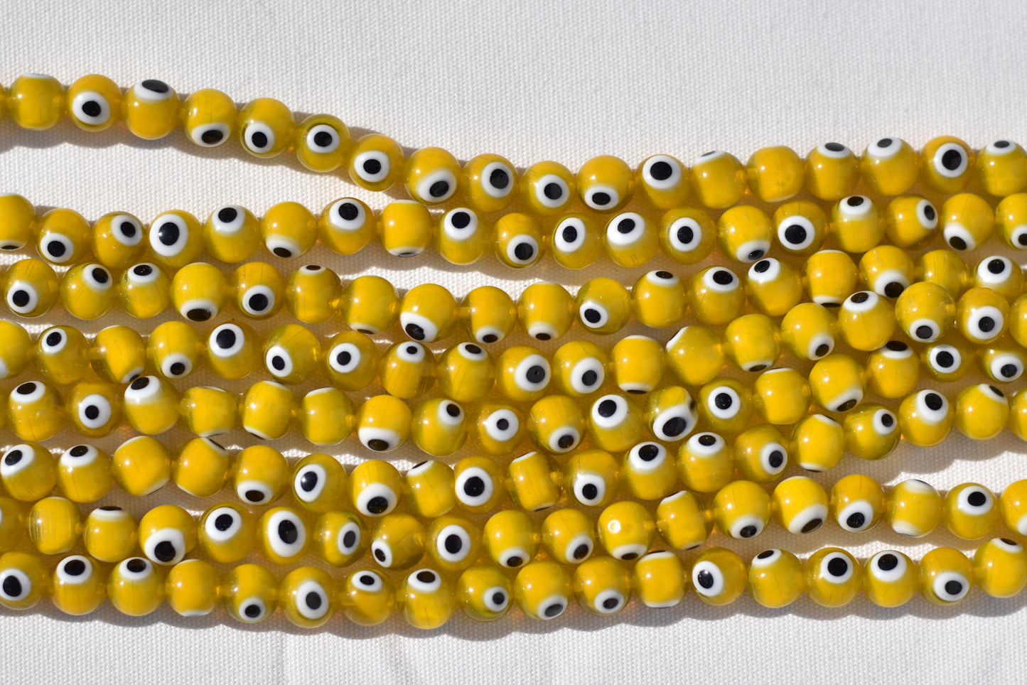 Crafting supplies such as Evil Eye Beads available at wholesale and retail prices, only at our crystal shop in San Diego!