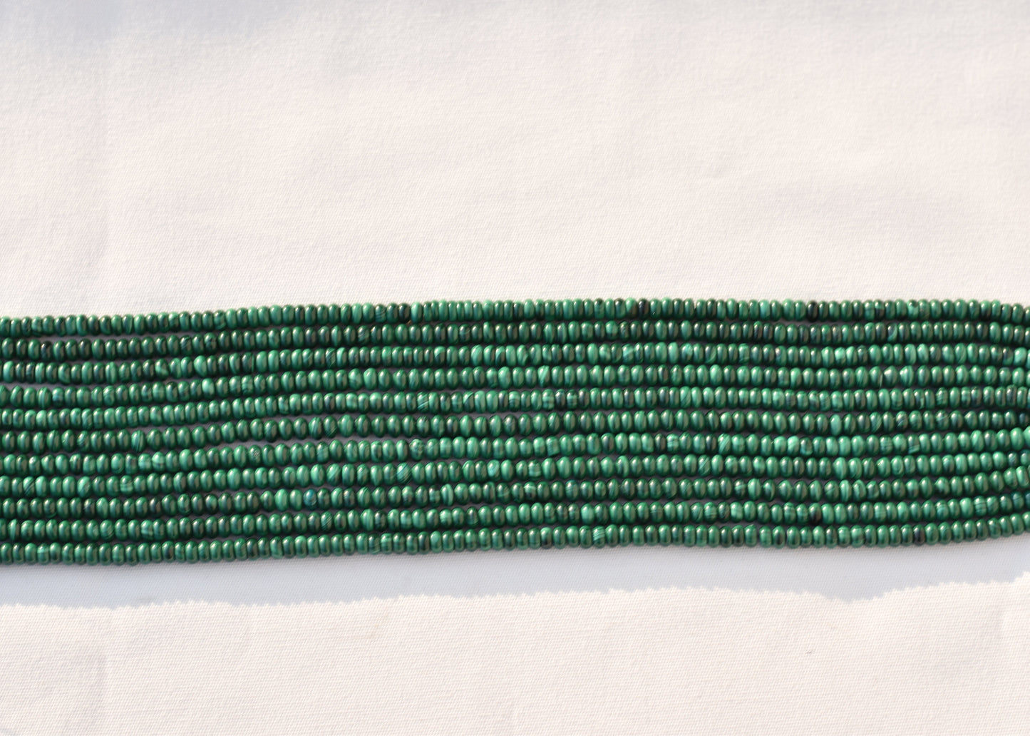 Crafting supplies such as Malachite Beads available at wholesale and retail prices, only at our crystal shop in San Diego!