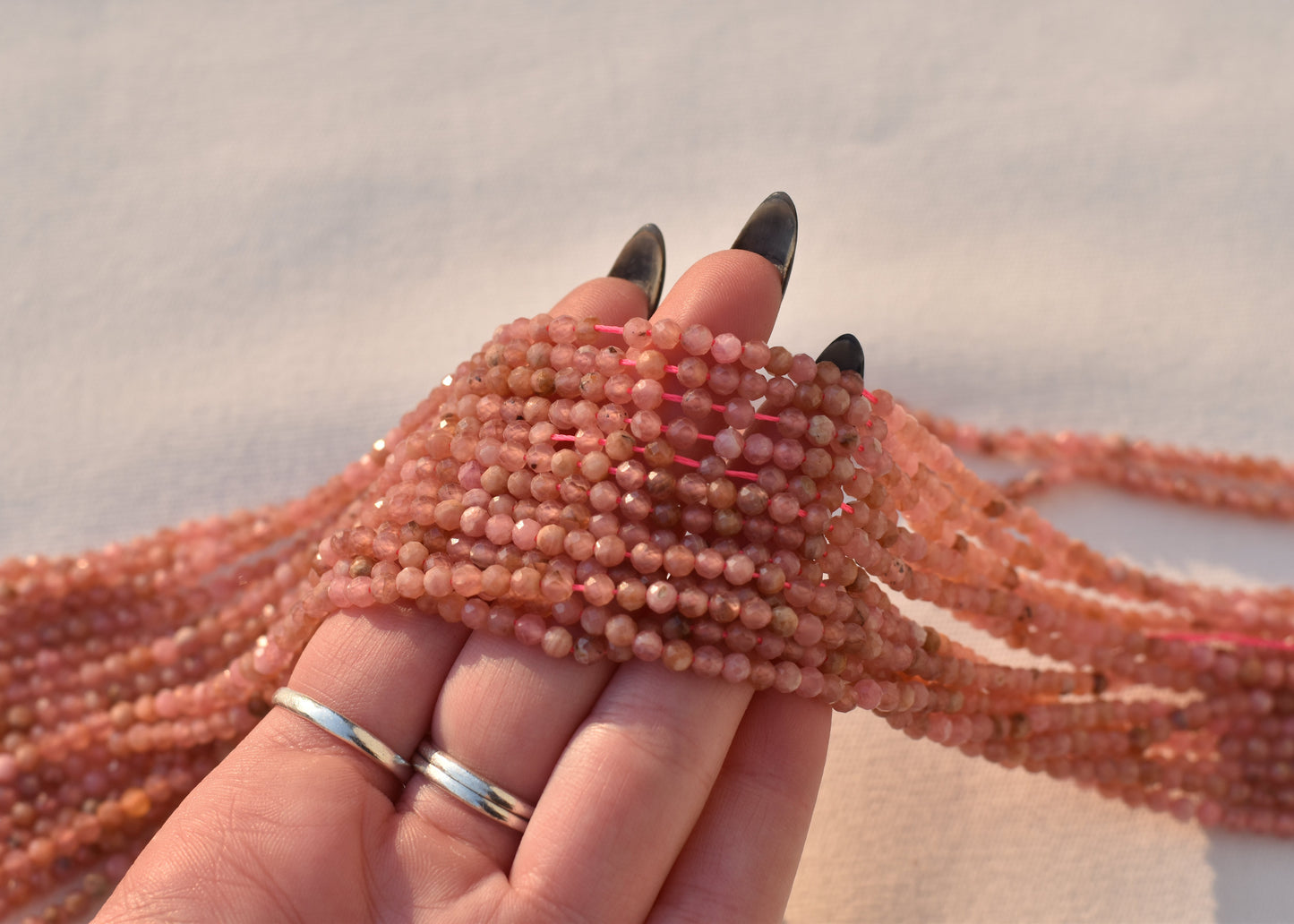 Crafting supplies such as Rhodochrosite Beads available at wholesale and retail prices, only at our crystal shop in San Diego!