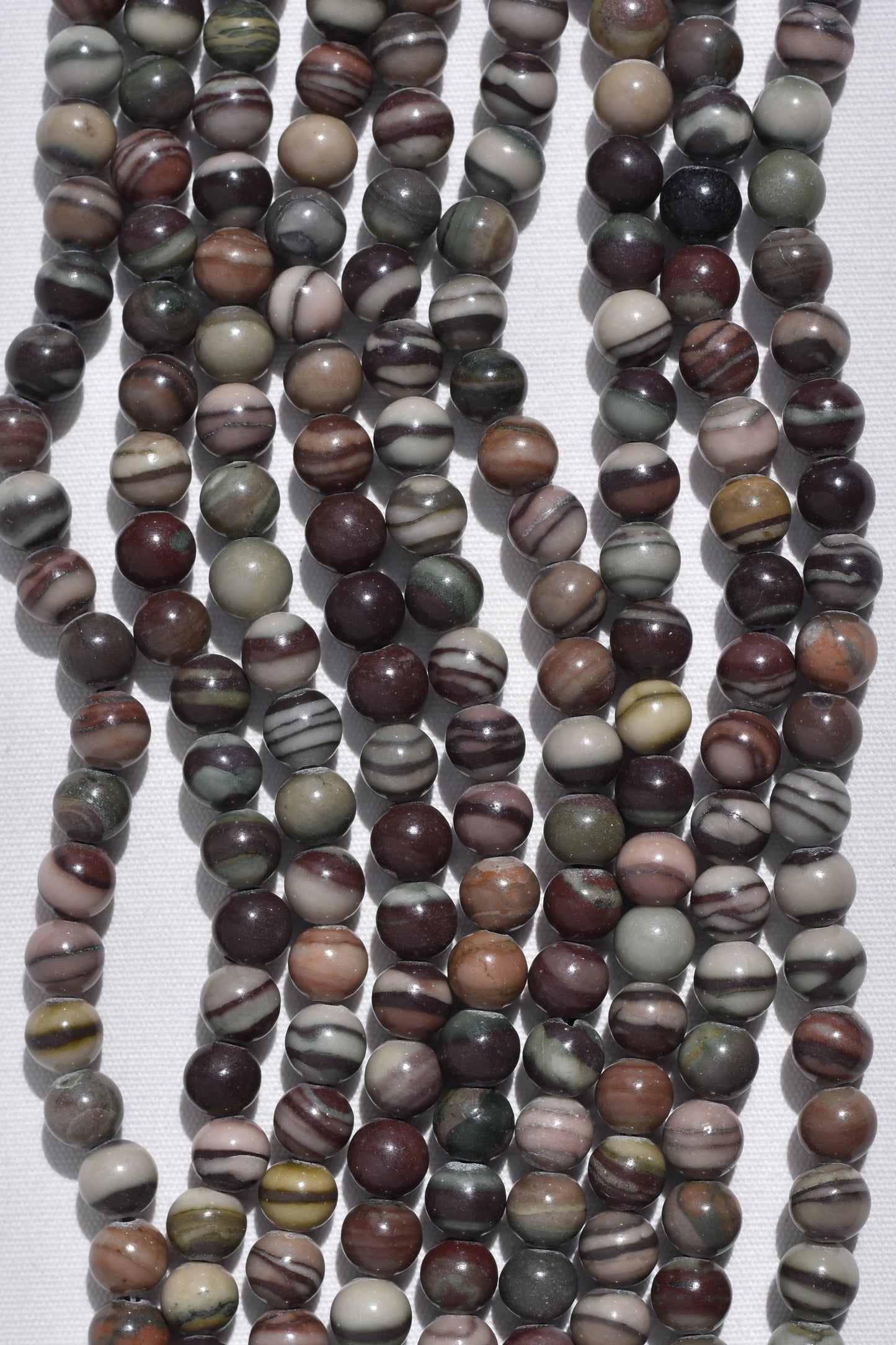 Crafting supplies such as Multicolor Zebra beads available at wholesale and retail prices, only at our crystal shop in San Diego!