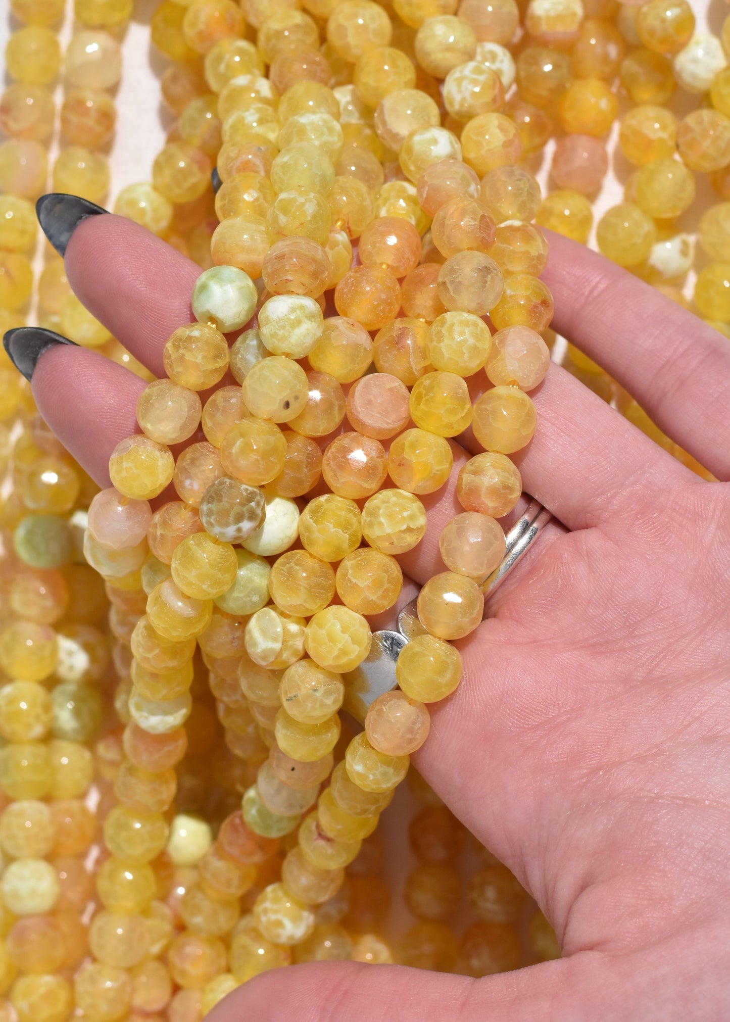 Crafting supplies such as Fire Agate beads available at wholesale and retail prices, only at our crystal shop in San Diego!