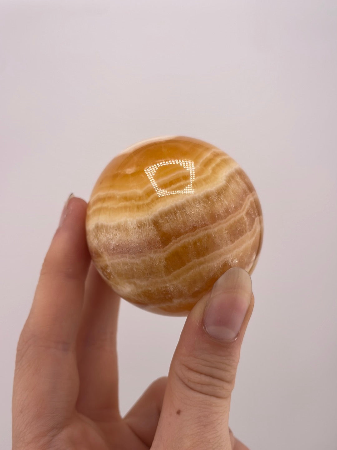 Honey clacite spheres available at wholesale and retail prices, only at our crystal shop in San Diego!