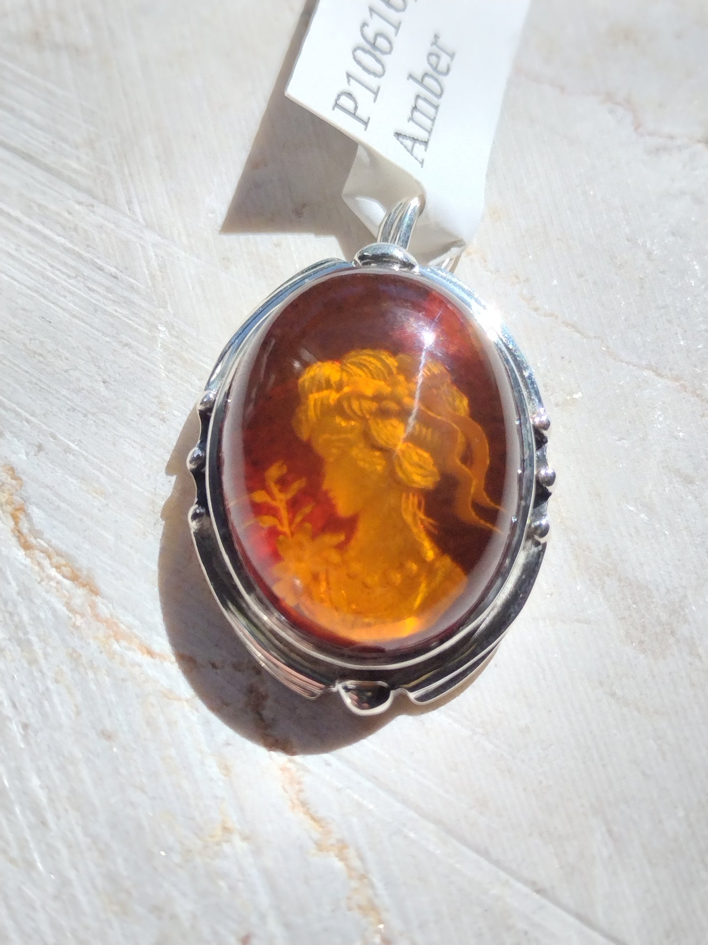 S.S. Engraved Amber Cameo Pendants