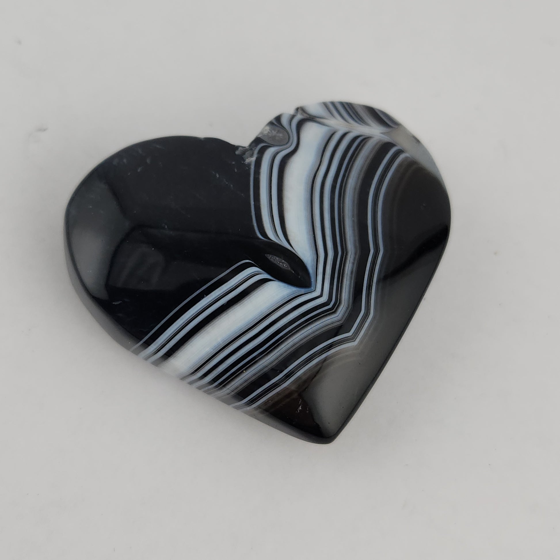 Black sardonyx hearts available at wholesale and retail prices, only at our crystal shop in San Diego!