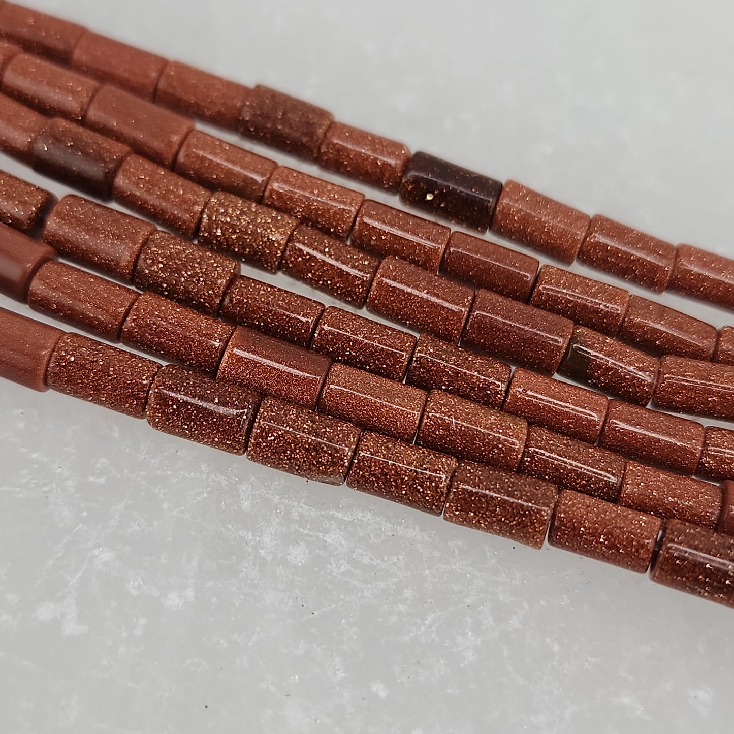 Short Brown Goldstone Tube Beads