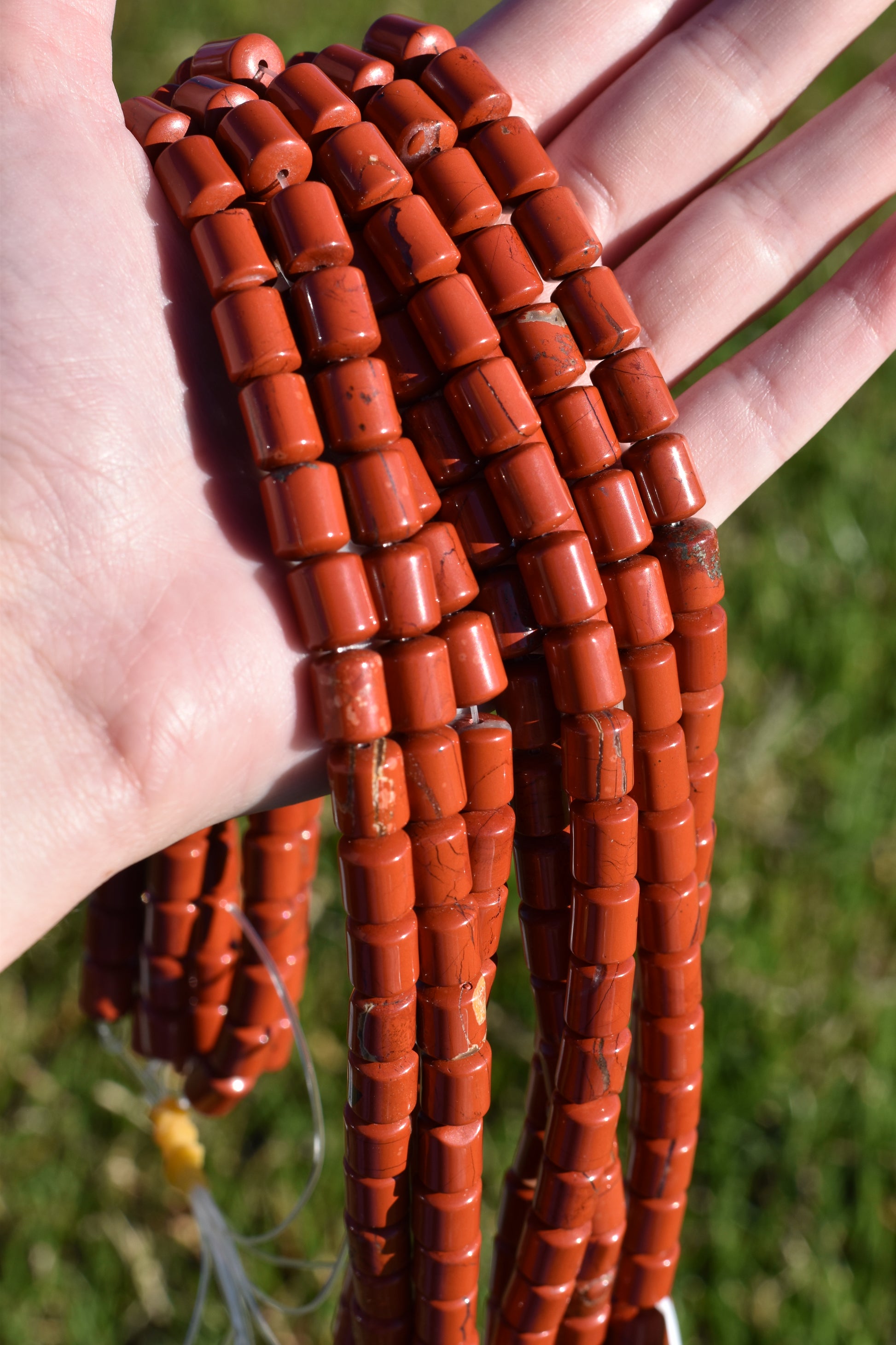 Crafting supplies such as red jasper tube beads available at wholesale and retail prices, only at our crystal shop in San Diego