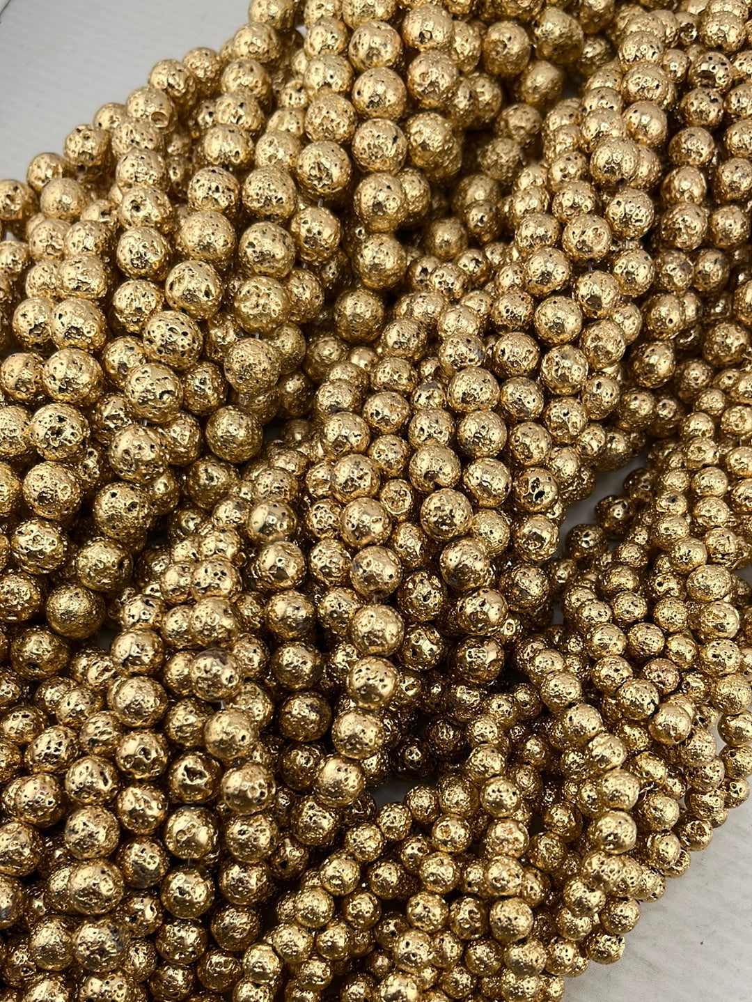 Crafting supplies such as gold lava beads available at wholesale and retail prices, only at our crystal shop in San Diego!