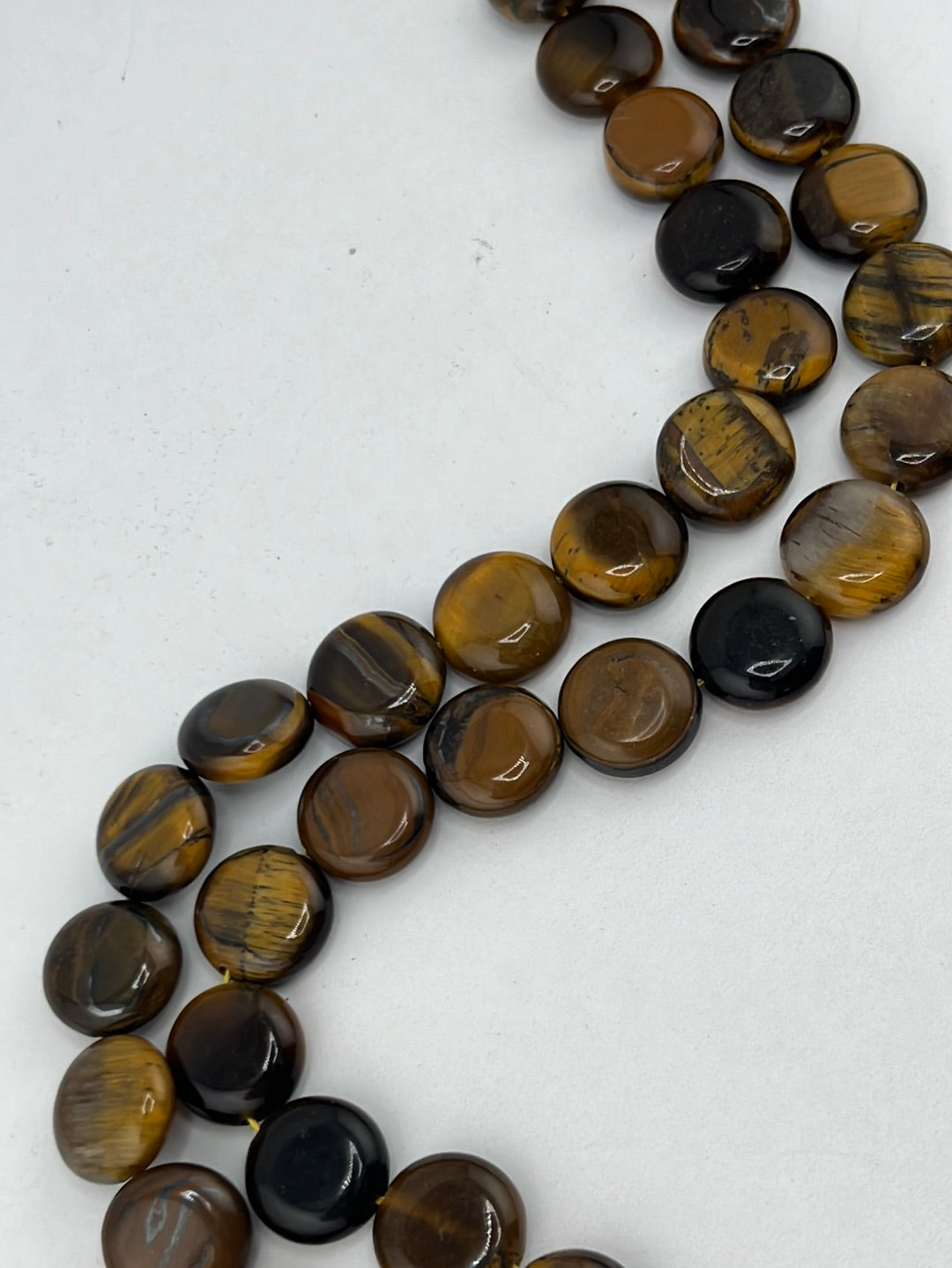 Crafting supplies such as tiger eye coin beads available at wholesale and retail prices, only at our crystal shop in San Diego!