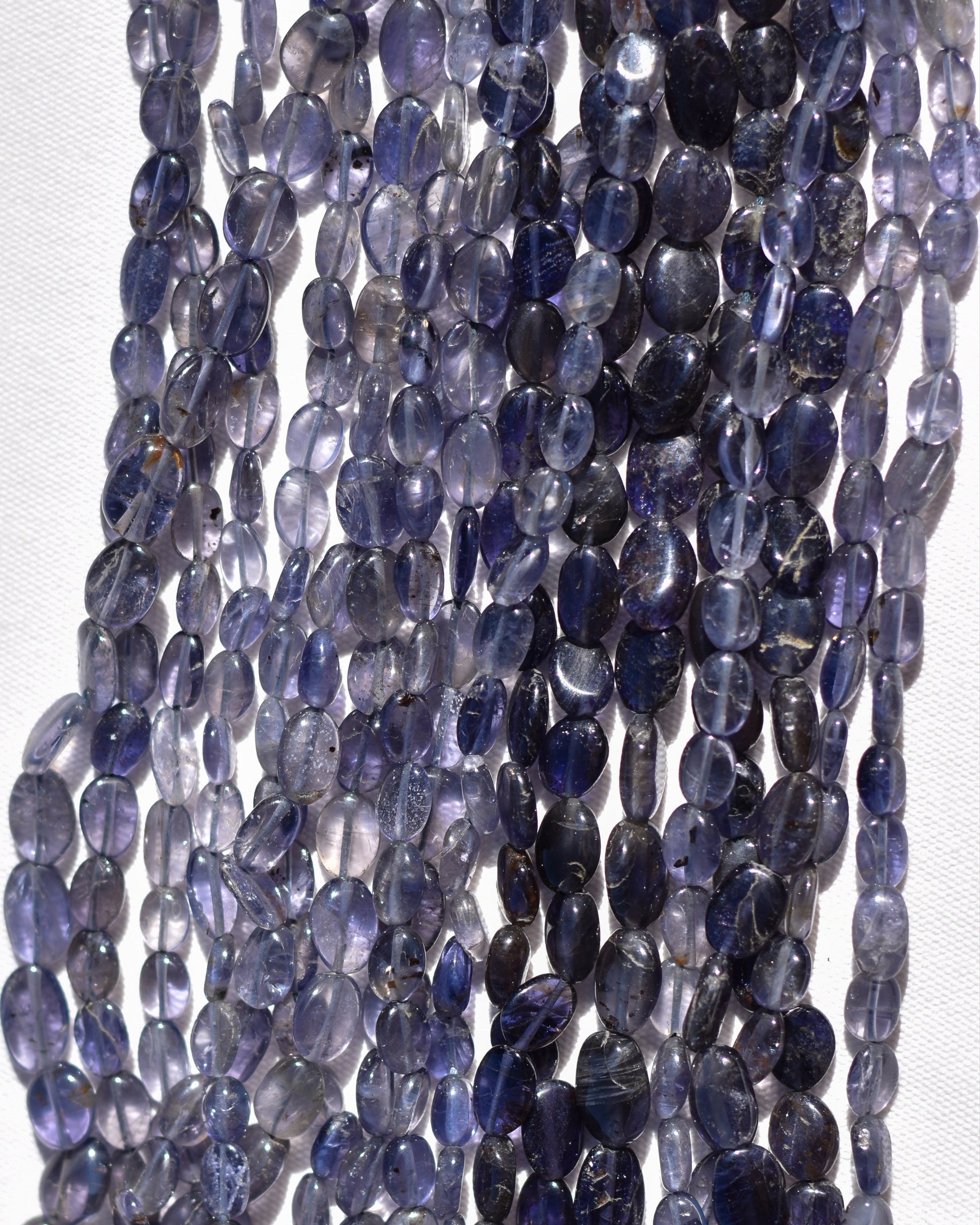 Check out our crystal shop in San Diego with Iolite beads and findings in sterling silver, gold, and more! 
At Pacific Beads, we carry crystals in a wide variety of forms. Find Iolite beads, Iolite geodes, Iolite carvings, and designer Iolite jewelry so that you can enjoy its healing properties in the way that best suits you and your lifestyle. The best part? You can shop crystals wholesale, meaning there is always something within your budget!