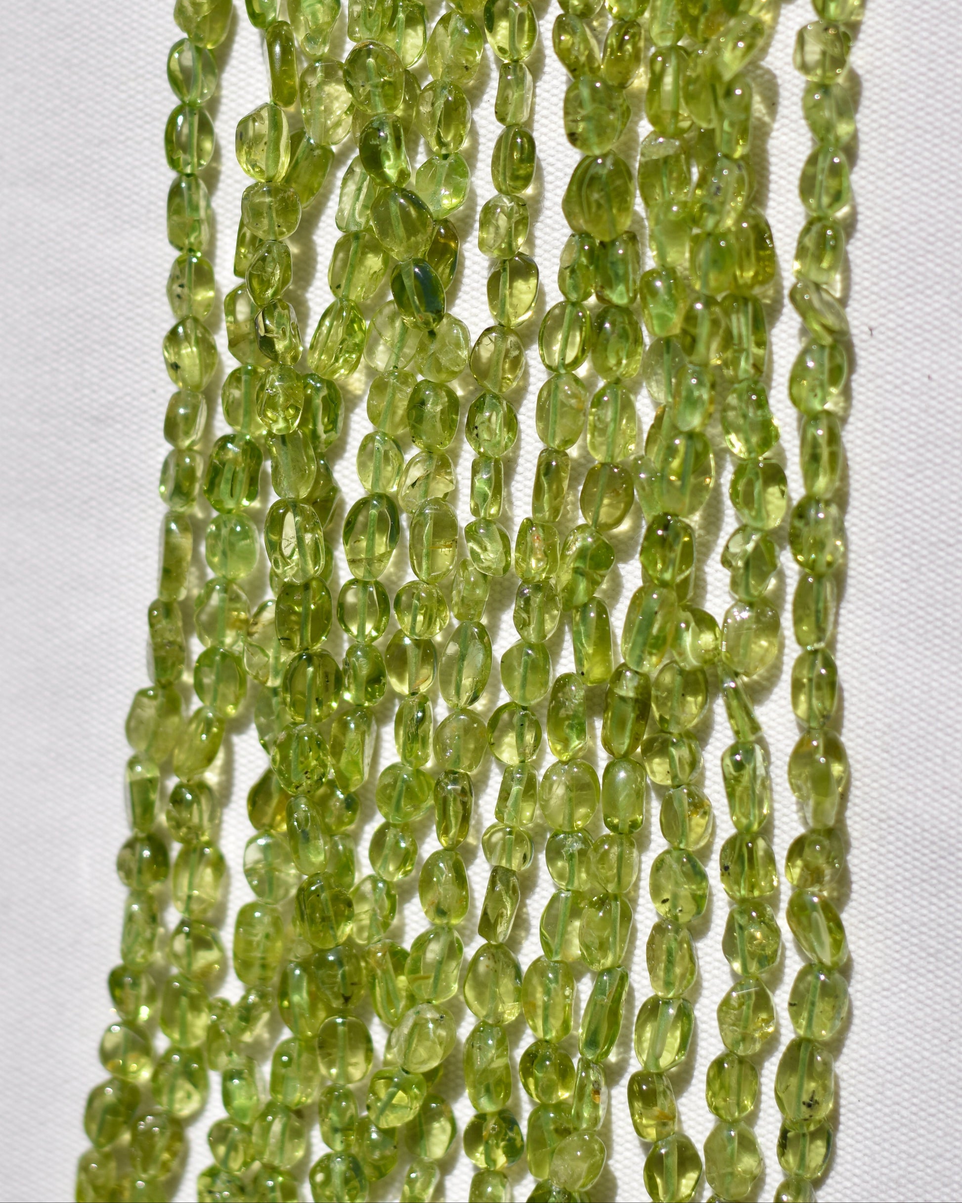 Check out our crystal shop in San Diego with Peridot beads and findings in sterling silver, gold, and more! 
At Pacific Beads, we carry crystals in a wide variety of forms. Find Peridot beads, Peridot geodes, Peridot carvings, and designer Peridot jewelry so that you can enjoy its healing properties in the way that best suits you and your lifestyle. The best part? You can shop crystals wholesale, meaning there is always something within your budget!