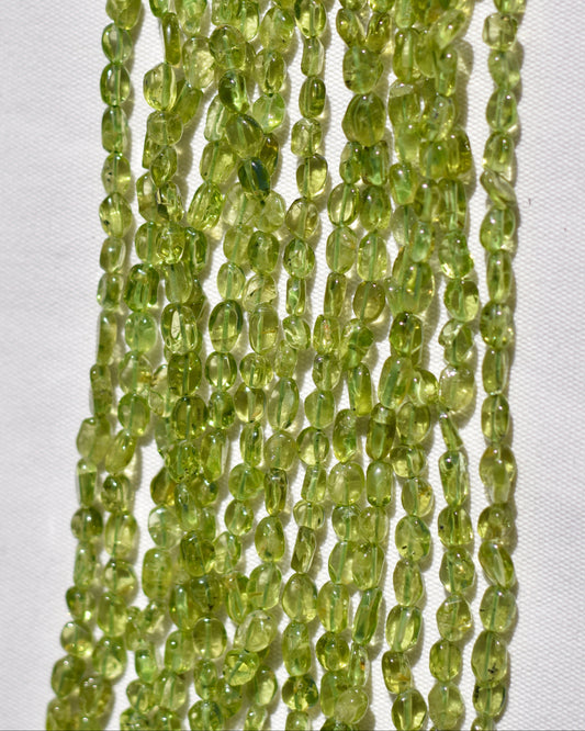 Check out our crystal shop in San Diego with Peridot beads and findings in sterling silver, gold, and more! 
At Pacific Beads, we carry crystals in a wide variety of forms. Find Peridot beads, Peridot geodes, Peridot carvings, and designer Peridot jewelry so that you can enjoy its healing properties in the way that best suits you and your lifestyle. The best part? You can shop crystals wholesale, meaning there is always something within your budget!