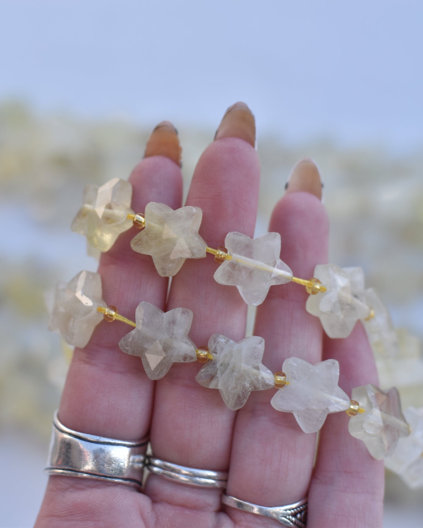 Lemon quartz is carved into star shaped beads and faceted to highlight its natural sunshine yellow surface. Lemon quartz is said to be a stone for improving confidence.
14mm

Check out our crystal shop in San Diego with lemon quartz beads and findings in sterling silver, gold, and more!
At Pacific Beads, we carry stones in a wide variety of forms. Find lemon quartz beads, lemon quartz carvings, and designer lemon quartz jewelry so that you can enjoy its healing properties in the way that best suits you and 