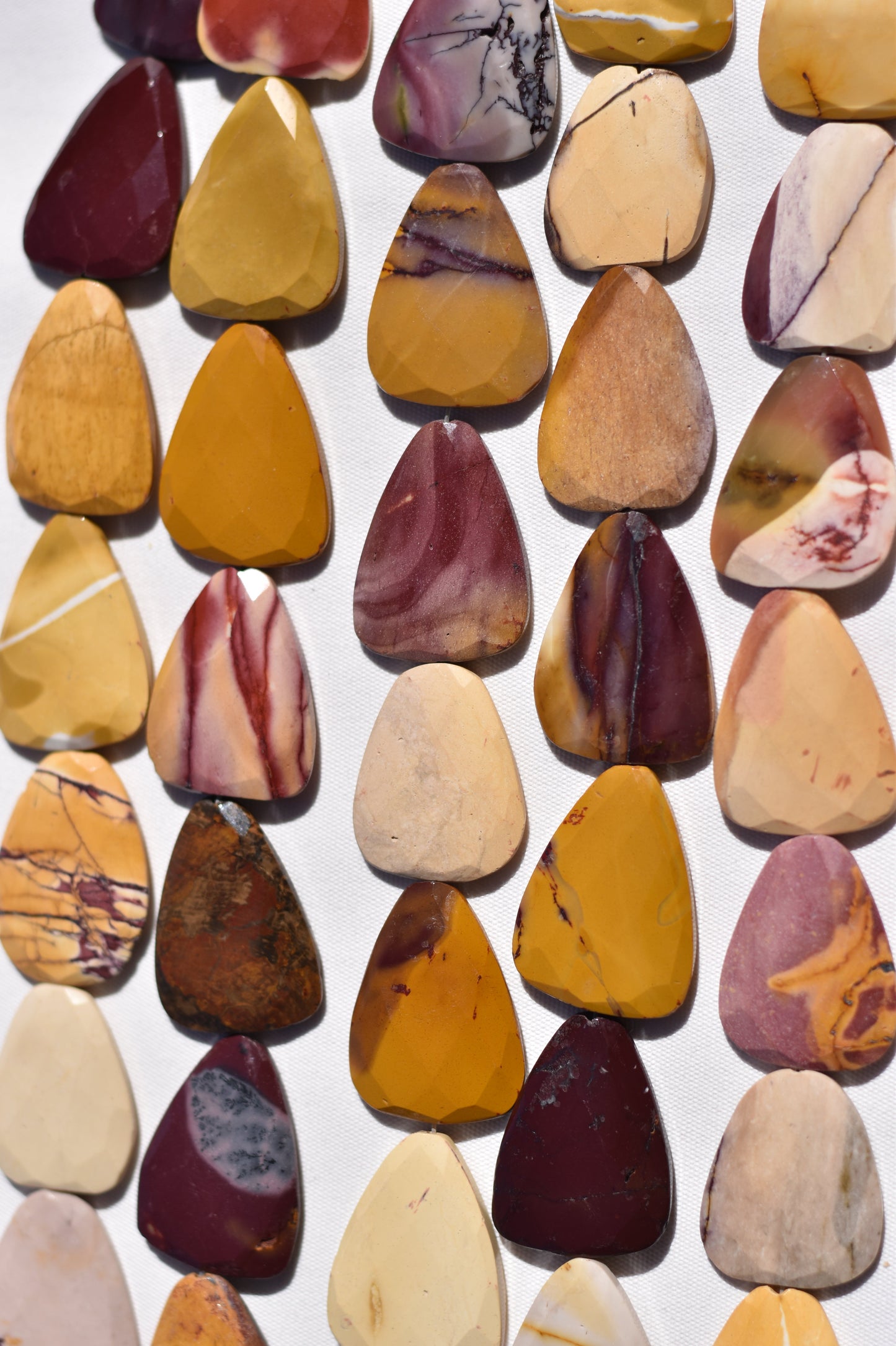 Mookite Faceted Round Triangle Beads