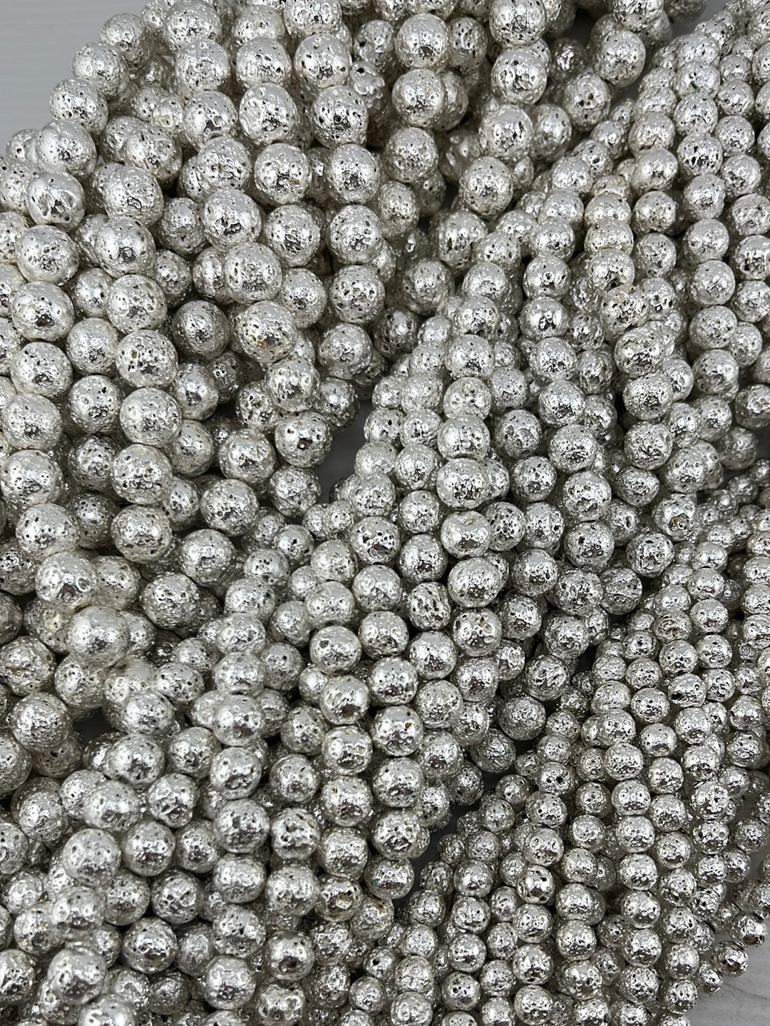 Crafting supplies such as silver lava beads available at wholesale and retail prices, only at our crystal shop in San Diego!