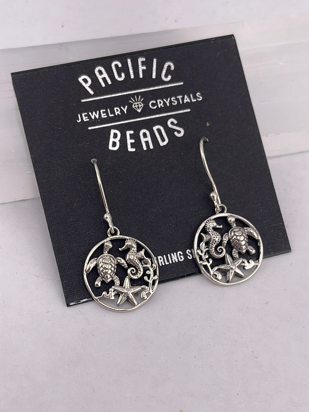 Sterling silver sea creature earrings available at wholesale and retail prices, only at our crystal shop in San Diego!