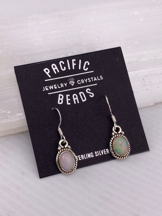 Sterling silver opal drop earrings available at wholesale and retail prices, only at our crystal shop in San Diego!