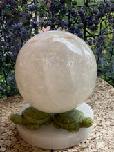 Load image into Gallery viewer, Clear Quartz Sphere on FREE Selenite and Jade Stand
