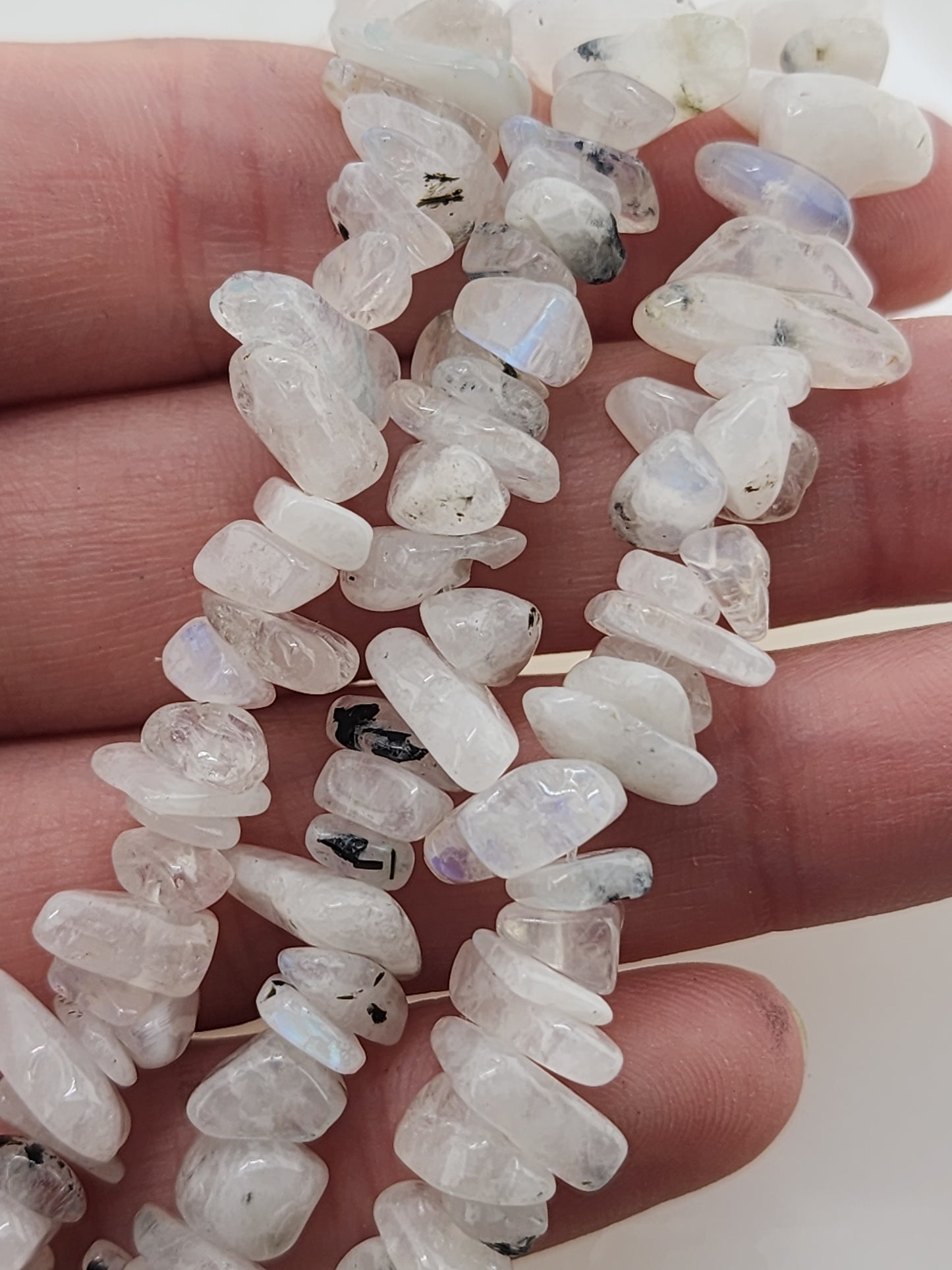 Crafting supplies such as rainbow moonstone chip beads available at wholesale and retail prices, only at our crystal shop in San Diego