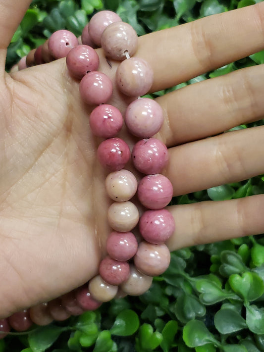 Crafting supplies such as rhodonite beads available at wholesale and retail prices, only at our crystal shop in San Diego!
