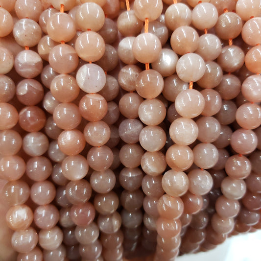 Crafting supplies such as peach moonstone beads available at wholesale and retail prices, only at our crystal shop in San Diego!
