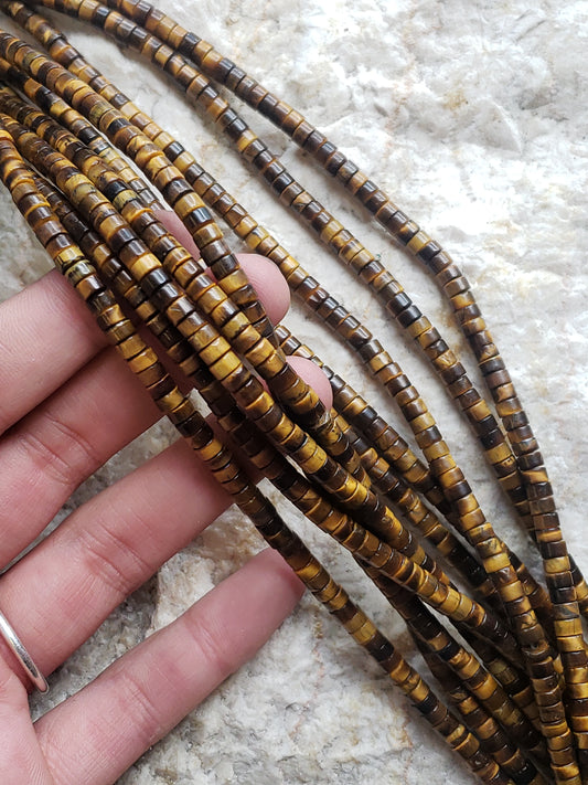 Crafting supplies such as tiger eye heishi beads available at wholesale and retail prices, only at our crystal shop in San Diego!
