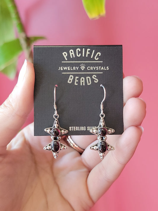 Sterling silver garnet star earrings available at wholesale and retail prices, only at our crystal shop in San Diego!