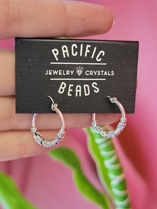Sterling silver Bali hoops available at wholesale and retail prices, only at our crystal shop in San Diego!