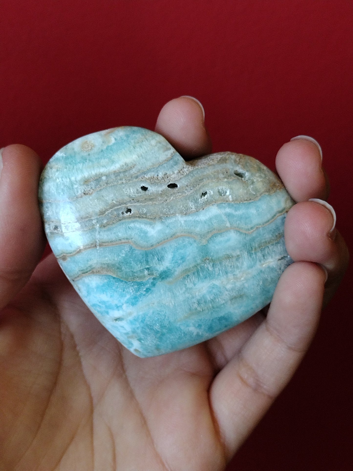 Blue aragonite, also known as Caribbean calcite, hearts available at wholesale and retail prices, only at our crystal shop in San Diego!