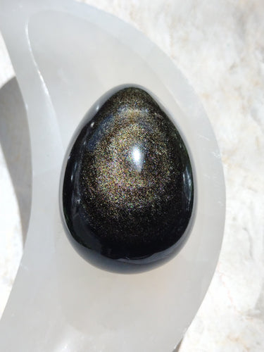 Golden sheen obsidian eggs available at wholesale and retail prices, only at our crystal shop in San Diego!