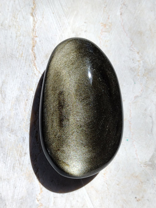 Golden sheen obsidian palmstones available at wholesale and retail prices, only at our crystal shop in San Diego!