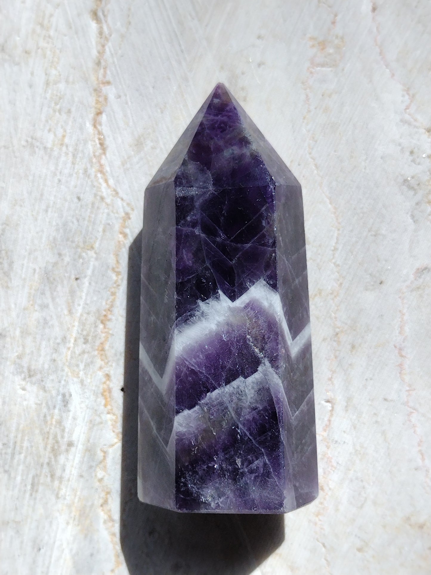 Chevron amethyst or Dream amethyst opens the crown chakra and eases feelings of anxiety. Shop our San Diego crystal shop for amethyst stones, amethyst carvings, amethyst jewelry and more!
