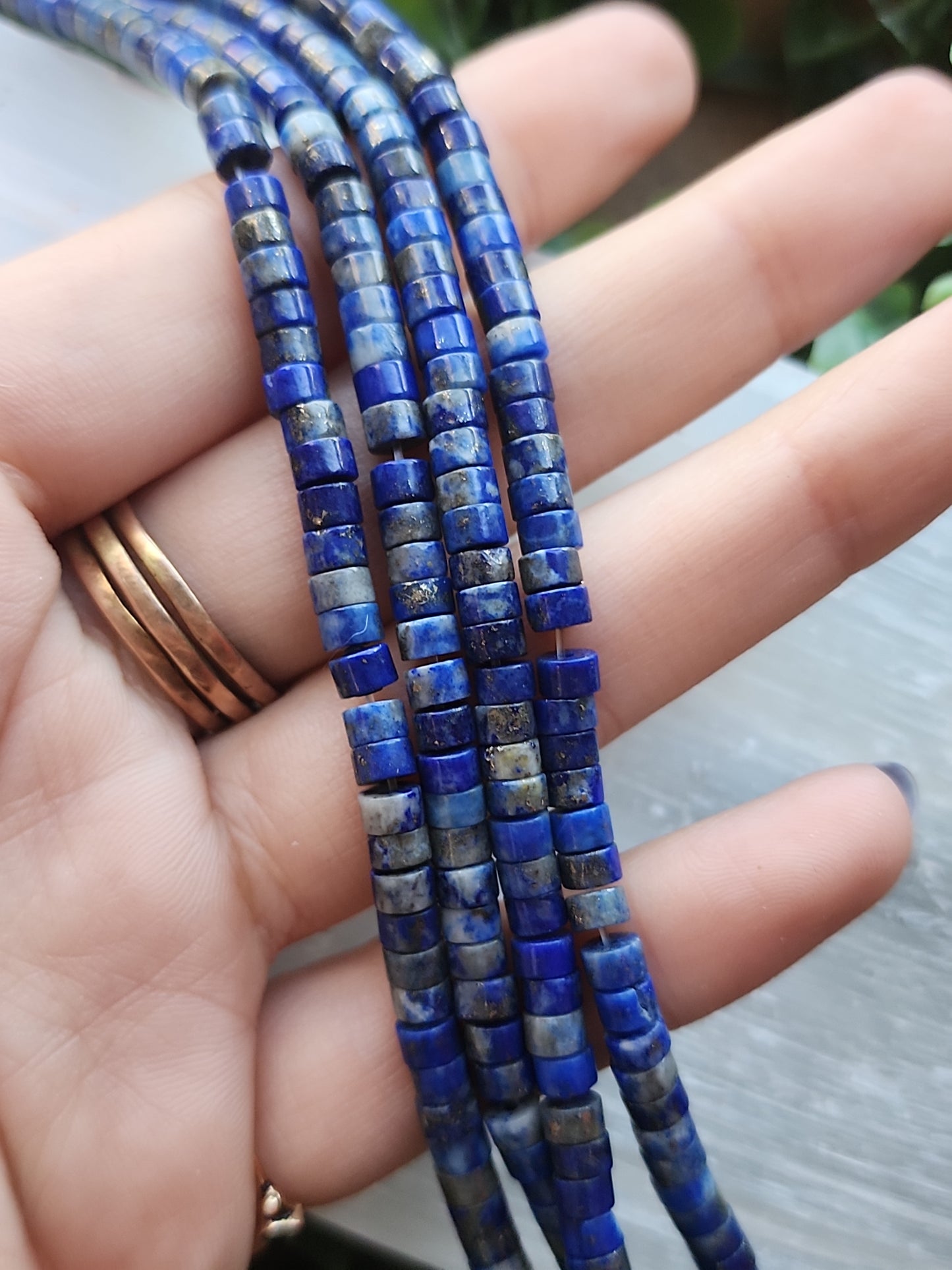 Crafting supplies such as lapis lazuli heishi beads available at wholesale and retail prices, only at our crystal shop in San Diego!