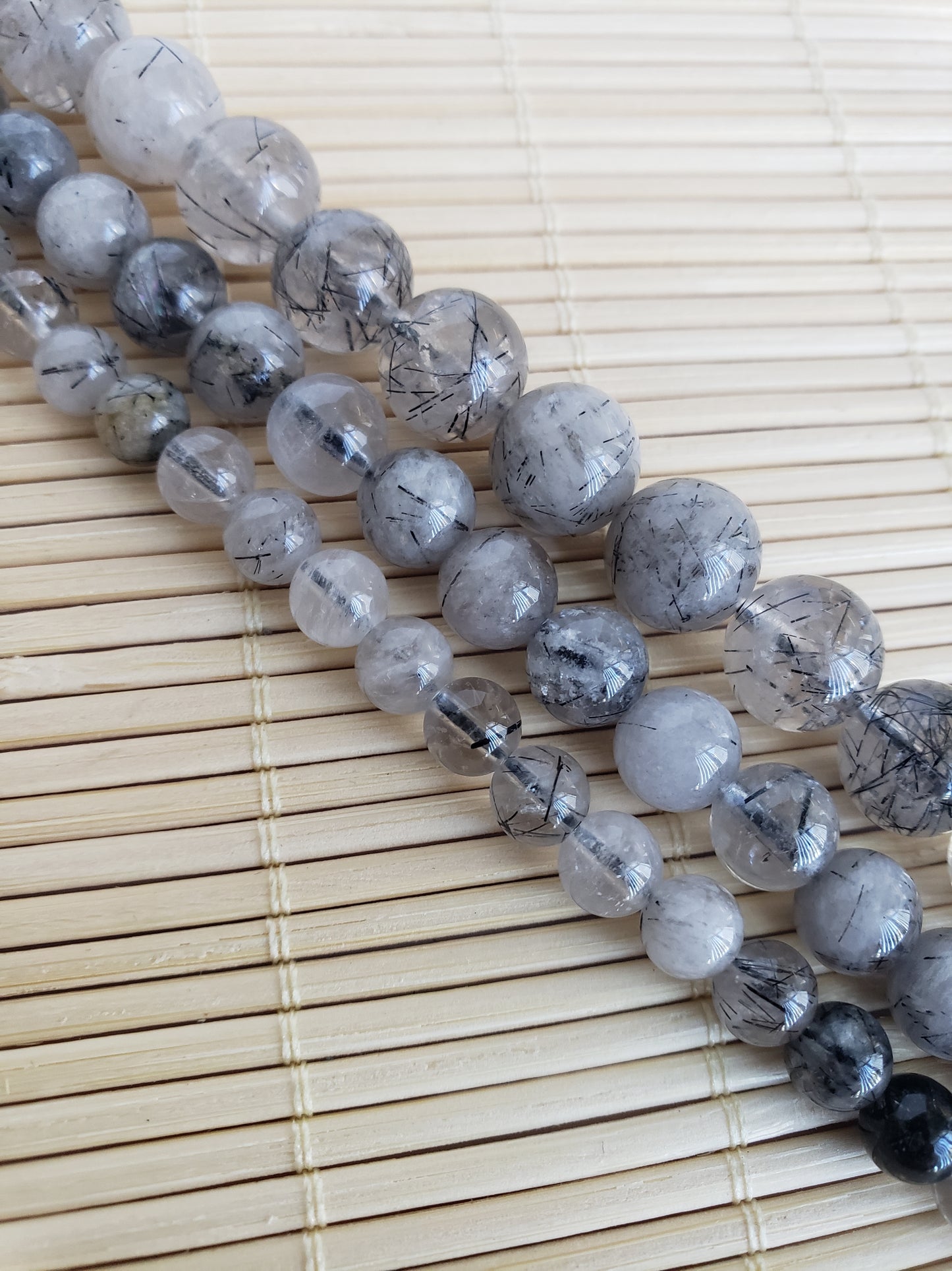 Crafting supplies such as black rutilated quartz beads available at wholesale and retail prices, only at our crystal shop in San Diego!