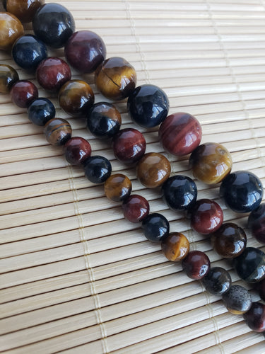 Crafting supplies such as red, blue, and yellow tiger eye beads available at wholesale and retail prices, only at our crystal shop in San Diego!
