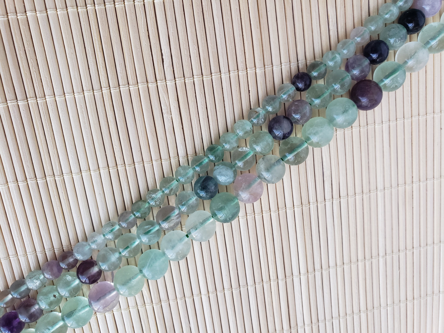 Crafting supplies such as rainbow fluorite beads available at wholesale and retail prices, only at our crystal shop in San Diego!