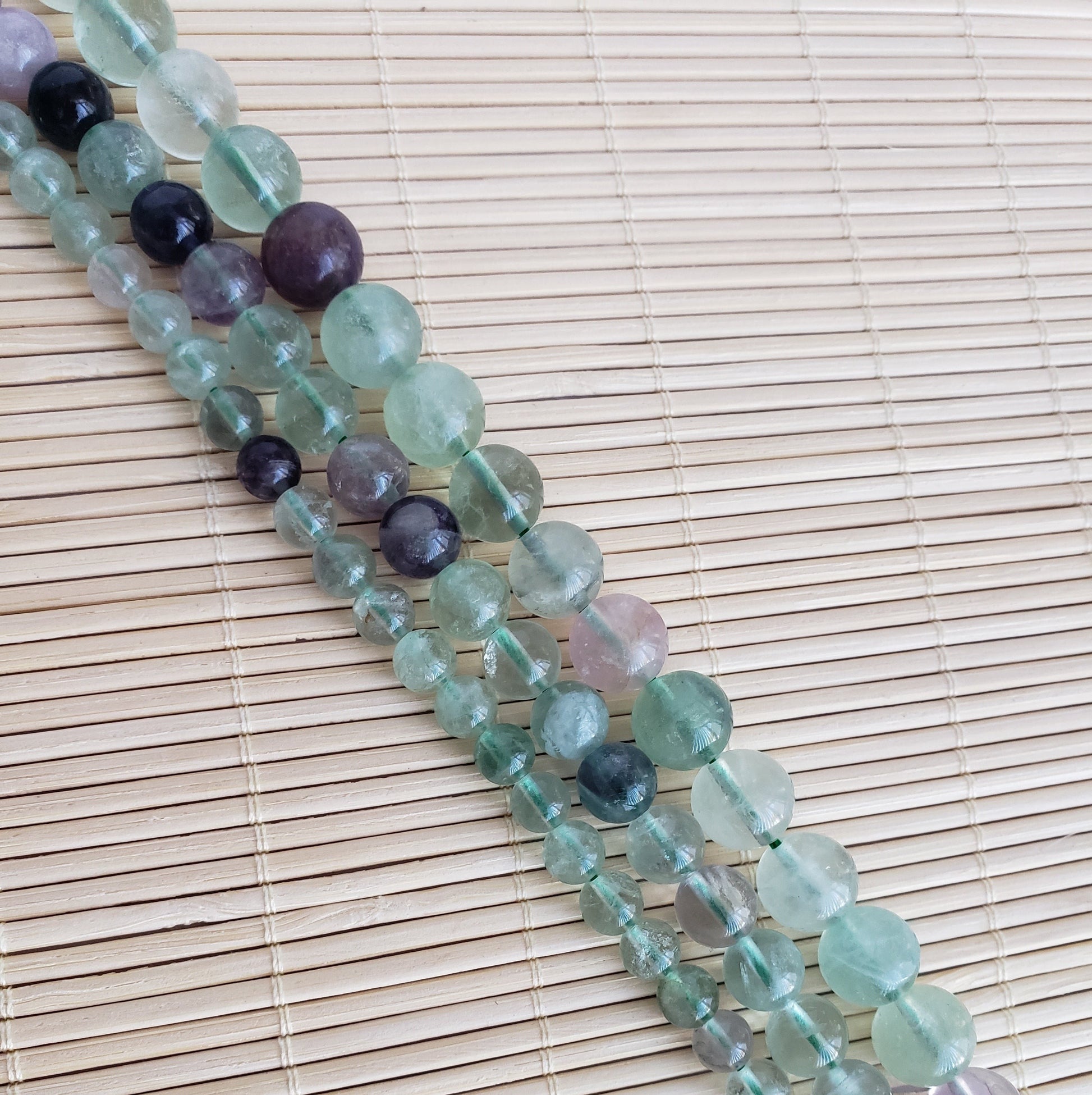 Crafting supplies such as rainbow fluorite beads available at wholesale and retail prices, only at our crystal shop in San Diego!