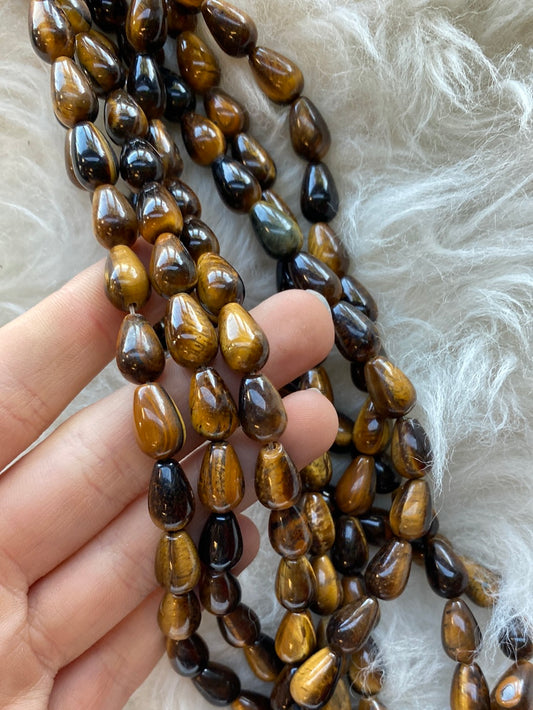 Crafting supplies tuch as tiger eye teardrop beads available at wholesale and retail prices, only at our crystal shop in San Diego!