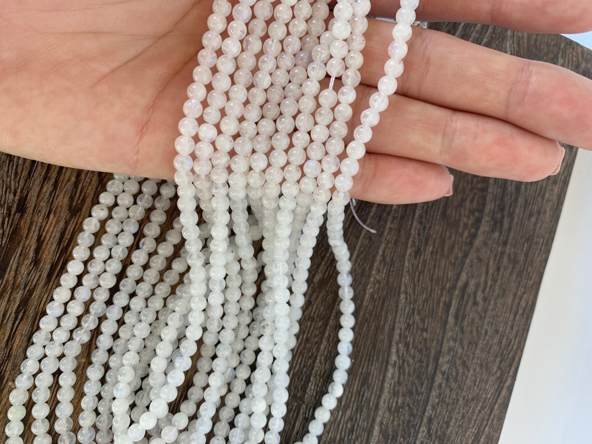 Crafting supplies such as rainbow moonstone beads available at wholesale and retail prices, only at our crystal shop in San Diego!